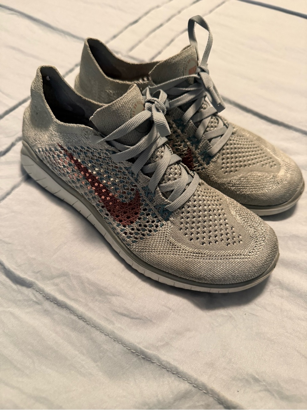 Nike Women’s Flyknit Athletic Shoes - Light Gray with Red Swoosh